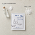 Phytomer Oligomer Pure Lyophilized Sea Water Bath flatlay on limestone surface with OLIGOMER Lyophilised Seawater and Sea Salt Minerals