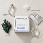 Phytomer Oligomer Silhouette Contouring Enhancer Marine Bath 8 sachets flatlay on limestone surface with OLIGOMER Seawater, Marine Trace Elements, Marine Algae, and Caffeine