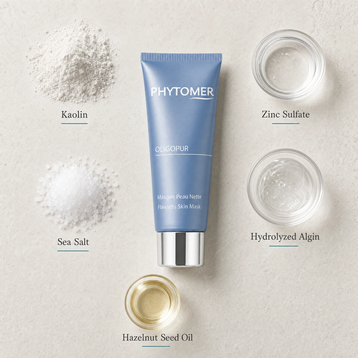 Phytomer Oligopur Flawless Skin Mask 50ml flatlay on limestone surface with Kaolin, Zinc Sulfate, Sea Salt, Hydrolyzed Algin, and Hazelnut Seed Oil