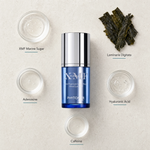 Phytomer Pionniere XMF Reset Eye Fluid 15ml flatlay on limestone surface with XMF Marine Sugar, Laminaria Digitata, Adenosine, Hyaluronic Acid, and Caffeine