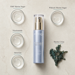 Phytomer Pionniere XMF Wrinkle and Dark Spot Supreme Serum 30ml flatlay on limestone surface with XMF Marine Sugar, Whitech Marine Sugar, Niacinamide, Adenosine, and Marine Criste