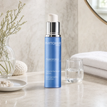 Phytomer Prebioforce Balancing Soothing Concentrate 30ml on a marble bathroom vanity with coastal botanicals in glass vessel, white towels and ceramic dish, premium at-home skincare setting