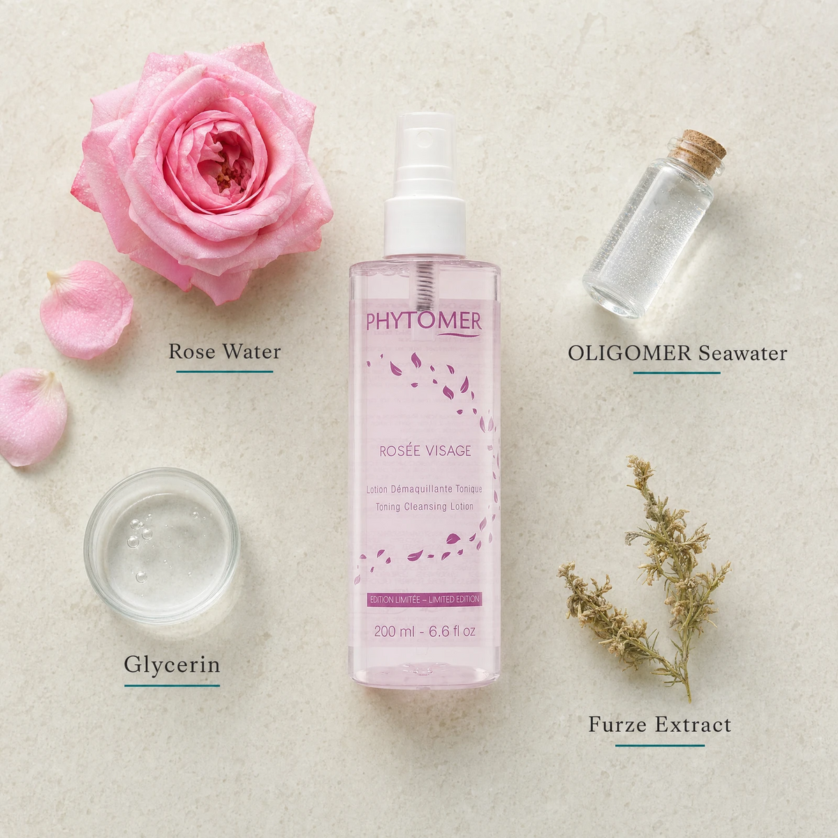 Phytomer Rosée Visage Toning Cleansing Lotion Mist Limited Edition 200ml flatlay on limestone surface with Rose Water, OLIGOMER Seawater, Glycerin, and Furze Extract