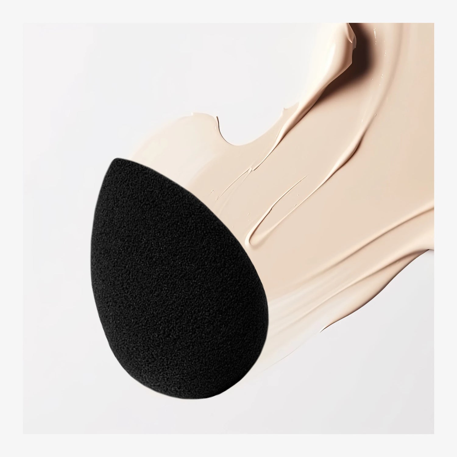 ELES Pro-Blender Make-Up Sponge with smooth foundation texture swipe on a clean neutral background