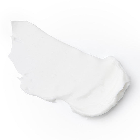 White sublime night cream product consistency on light background