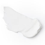 White sublime night cream product consistency on light background