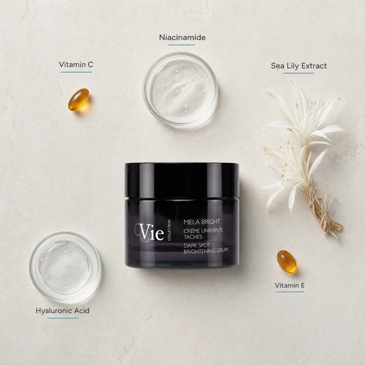 Vie Collection Mela Bright Dark Spot Brightening Cream 50ml flatlay on limestone surface with Vitamin C, Niacinamide, Sea Lily Extract, Hyaluronic Acid, and Vitamin E