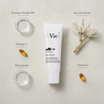 Vie Collection Mela White Protective Sunscreen SPF30 50ml flatlay on limestone surface with Titanium Dioxide SPF, Vitamin C, Niacinamide, Sea Lily Extract, and Vitamin E