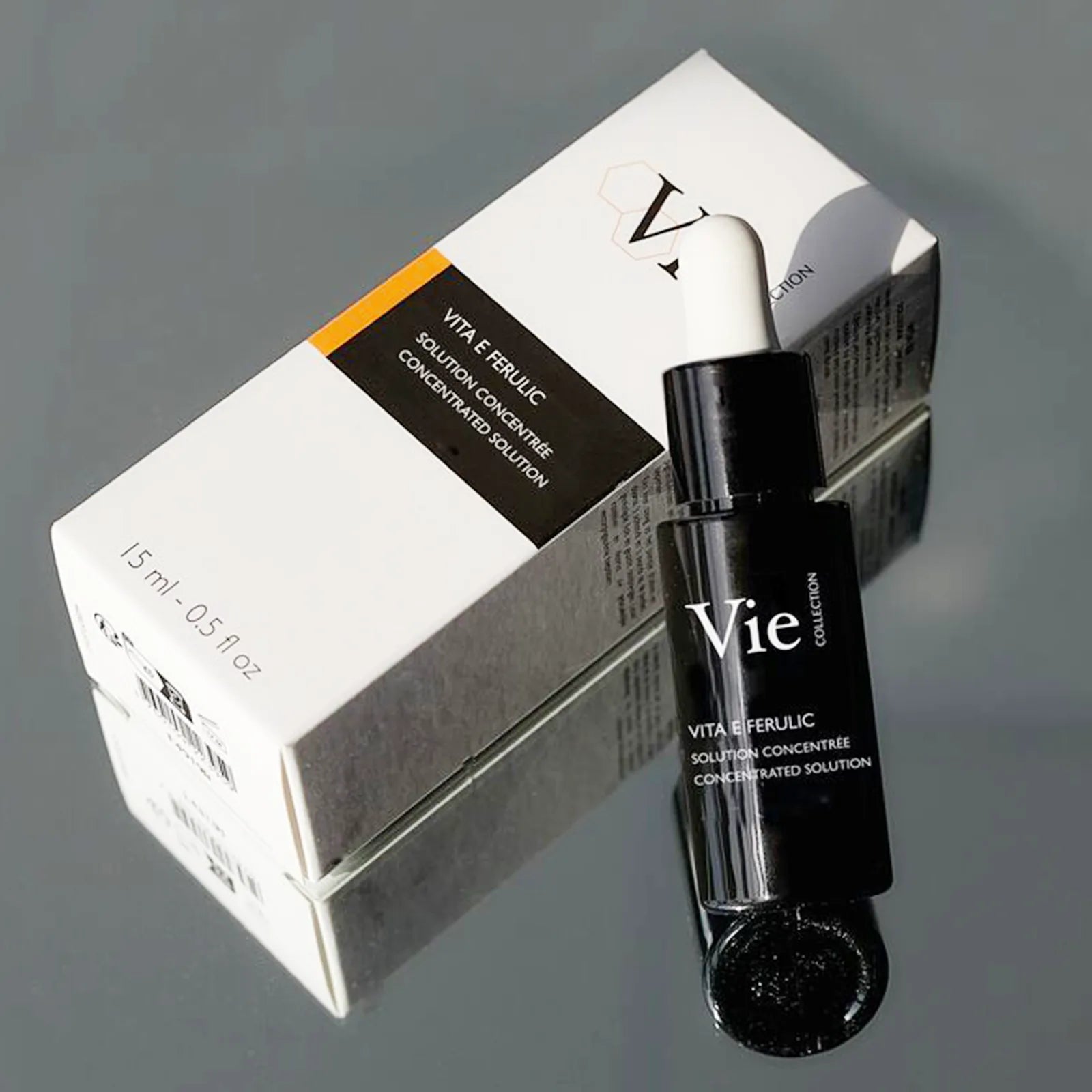 VIE COLLECTION Vita E Ferulic Concentrated Solution 15ml with packaging on a reflective surface